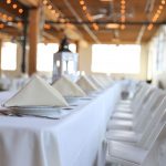 white padded folding chairs and table 