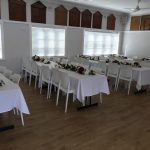 white trestle table with white tiffany chairs 