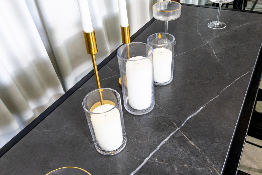 Black rectangular tapas table with candles and wine glasses decorated